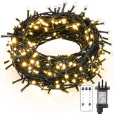 Coiled string lights with remote control and power adapter on a white background